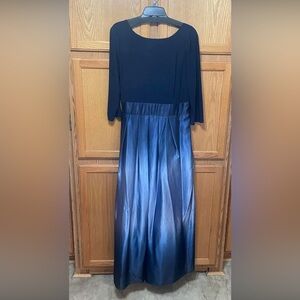 This dress has only been worn once. It also has pockets in it.